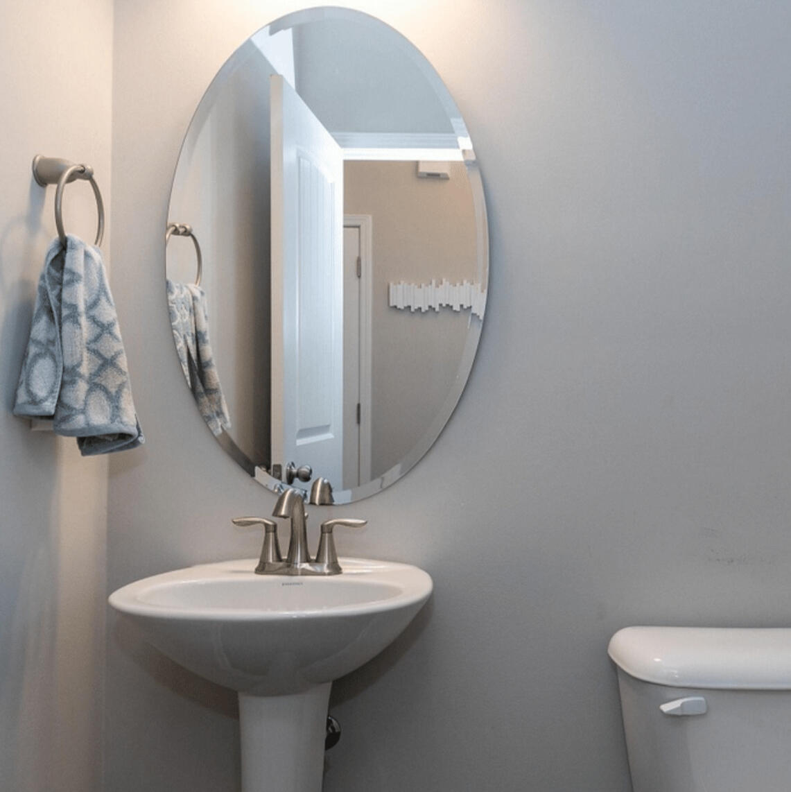 Half bathroom with vanity and mirror in the Garner townhouse rental