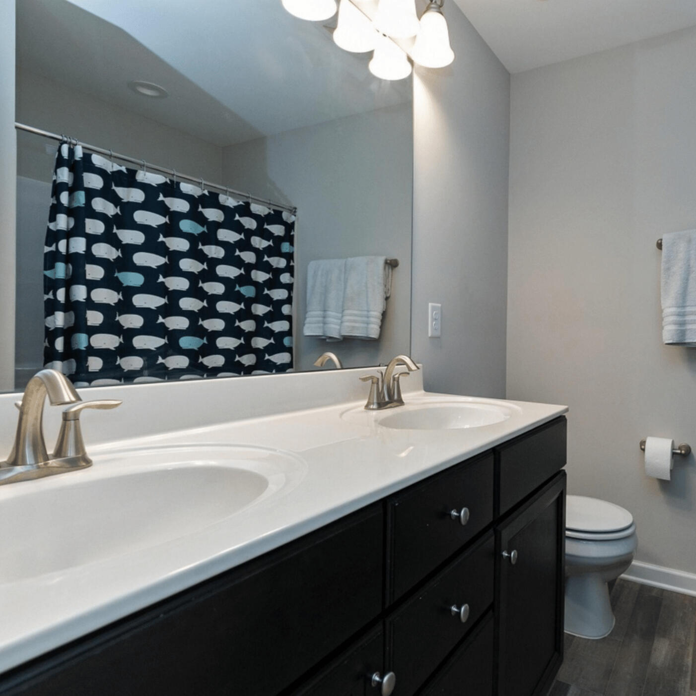 Full bathroom with double vanity in the Garner townhouse rental